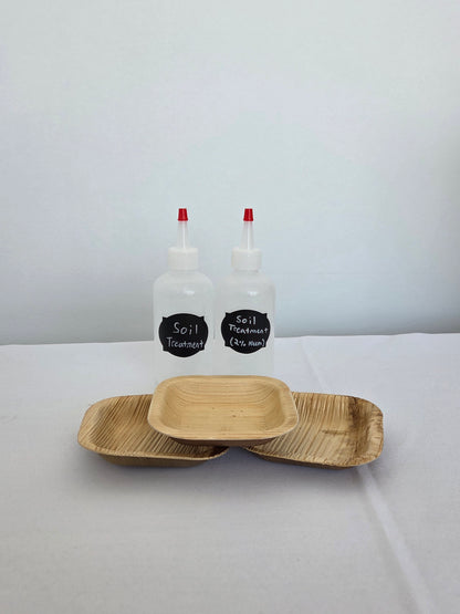 Two soil drench bottles with three bamboo bowls 