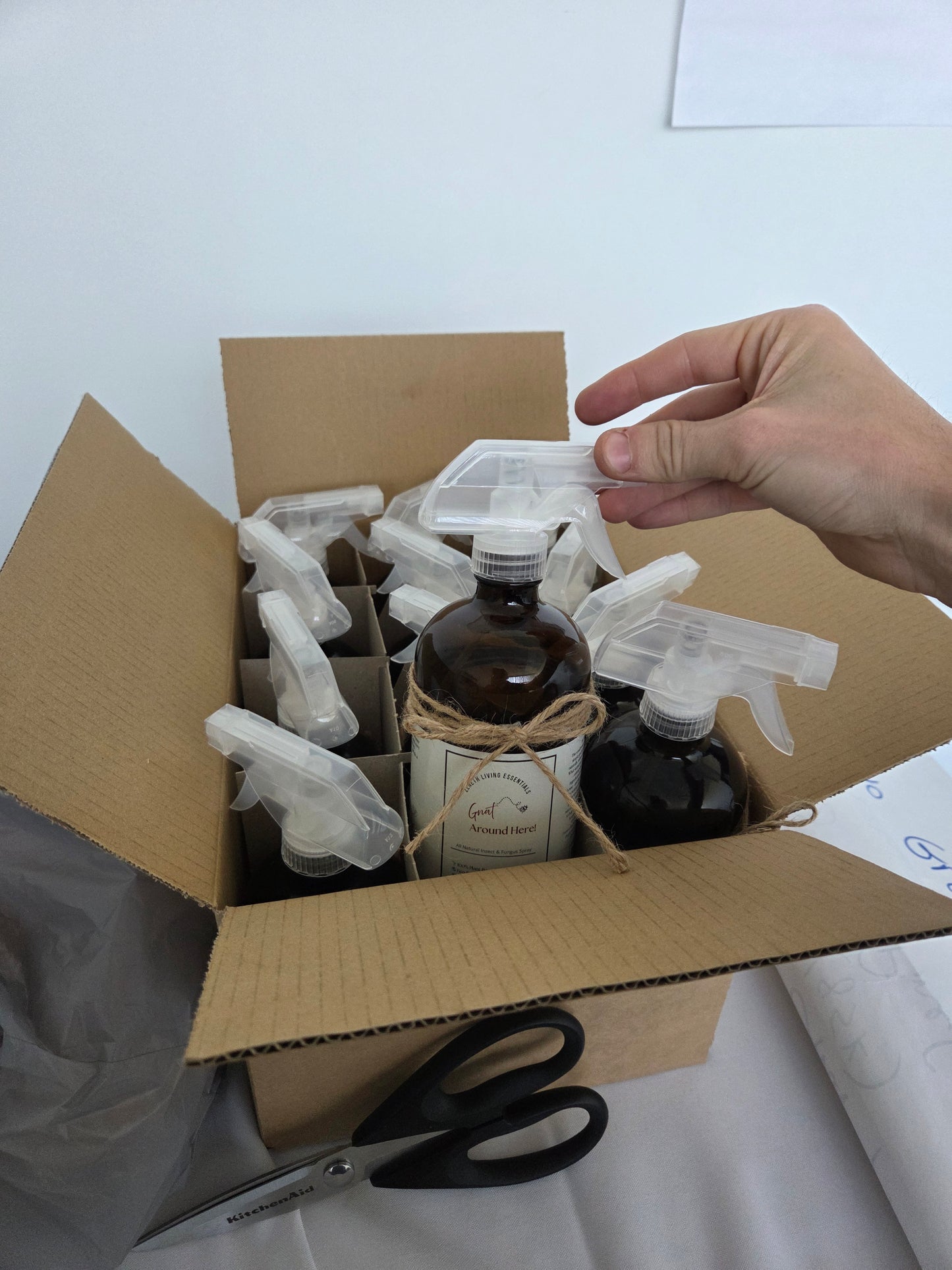 Photo showing multiple product bottles ready to ship out from batch of orders 